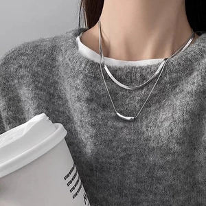 Double-layered titanium steel snake bone chain with a sleek curved bar pendant for women