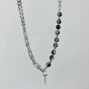 Detail of hip-hop necklace with cracked glass beads and silver star pendant