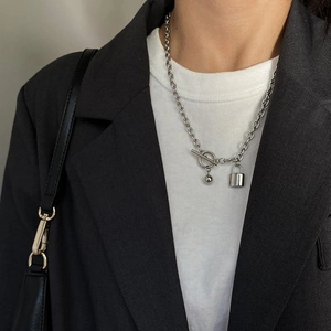 Minimalist titanium steel padlock necklace with OT buckle on a professional model