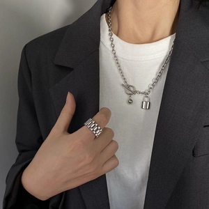 Minimalist silver chain necklace with lock pendant and wide textured metal ring set