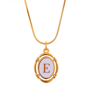 Gold plated titanium steel oval pendant necklace with letter E on white ceramic