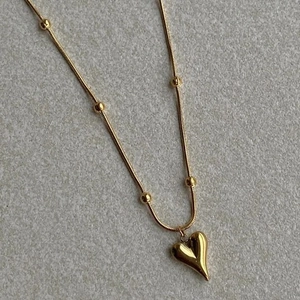 Minimalist gold titanium steel heart pendant necklace with beads on a snake chain