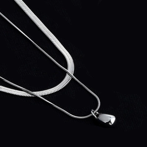 Double layer stainless steel necklace featuring a water drop pendant on a snake chain