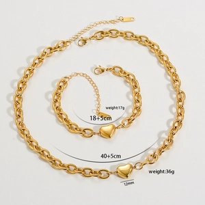 Chunky gold O-link chain necklace and bracelet set with heart pendants and lobster clasps