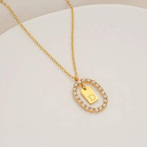 Collana in acciaio inossidabile placcato oro con pendente ovale in cristallo e lettera D
