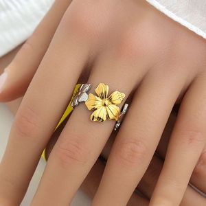 Exaggerated two-tone stainless steel open ring with gold floral petal design and silver accents