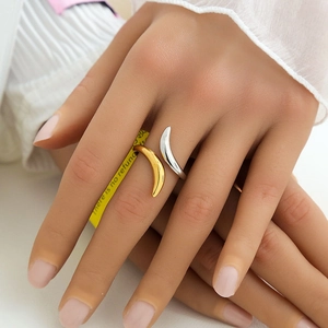 Polished gold and silver two-tone crisscross crescent ring with a minimalist open design