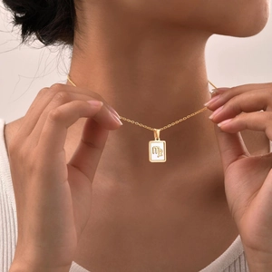 Titanium steel Virgo zodiac necklace with shell pendant on a dainty gold chain for women