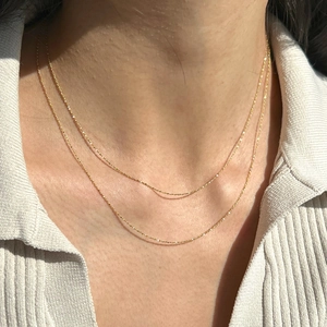 Minimalist double-layered gold stainless steel necklace with sparkling snake and satellite chains