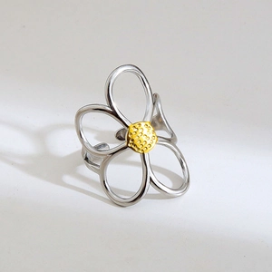 Two-tone stainless steel open ring with hollow flower design and golden textured center