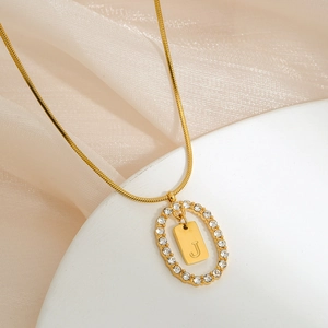 Golden stainless steel snake chain with crystal-encrusted letter J pendant