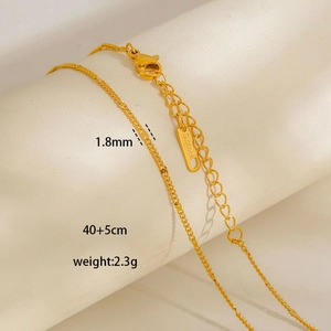 Macro detail of 1.8mm stainless steel gold necklace chain showing lobster clasp and texture