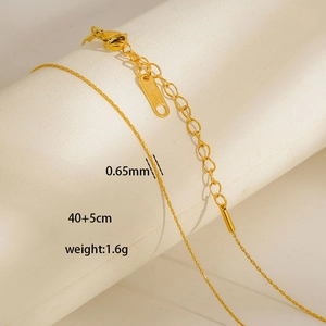 Detail of 0.65mm gold stainless steel thin chain necklace with lobster clasp and adjuster
