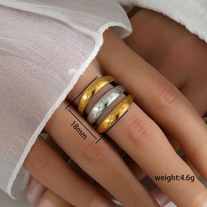 Detailed view of triple stacked stainless steel rings showing 18mm width and 4.6g weight