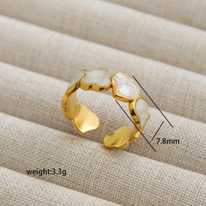 Gold open ring featuring white enamel heart charms and adjustable band for women