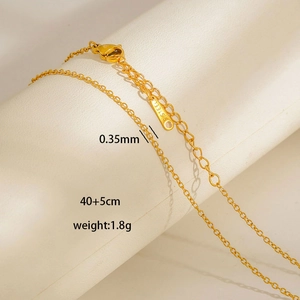 Macro shot showing 0.35mm gold stainless steel chain necklace with adjustable clasp