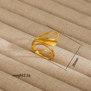 Detail view of gold turquoise ring showing 2.2g weight and 26mm geometric hollow design