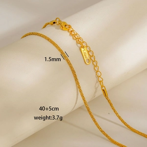 Close-up of 1.5mm gold wheat chain in stainless steel with detailed length measurements