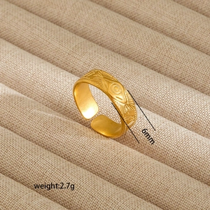 Detail view of 6mm wide 18K gold plated stainless steel sunburst open ring 2.7g