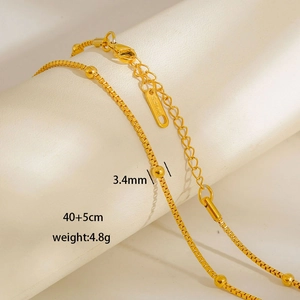 Detail of gold stainless steel beaded chain with 3.4mm beads and secure lobster clasp