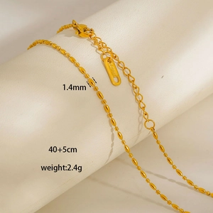 Detail of 1.4mm gold stainless steel bead chain with lobster clasp and extender