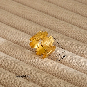Detail view of 12.3mm gold leaf textured ring with dimensions on velvet tray