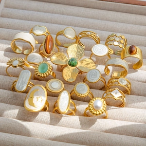 Retro gold stainless steel ring set with pearls and gemstones in jewelry box