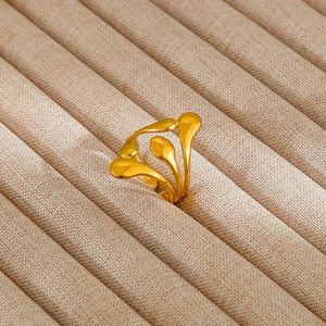 Detailed view of vintage gold enamel pearl silver ring with multi-layer water drop design