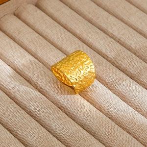 Minimalist gold stainless steel wide ring with hammered texture in vintage metal style