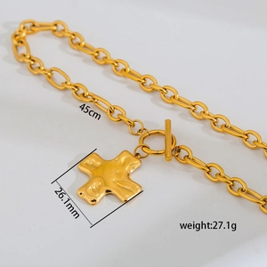 Detail of layered gold chain with OT toggle clasp and hammered cross pendant 45cm
