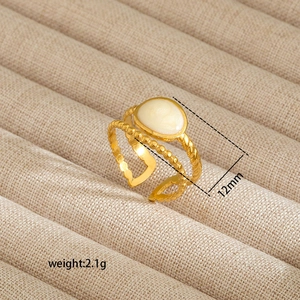 Macro shot of 18K gold plated irregular ring with white stone inlay and 12mm size detail