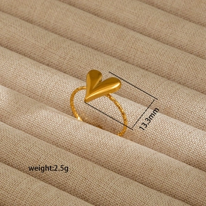 Close-up of 18K gold plated heart ring with hammered texture weighing 2.5g and 13.3mm wide