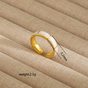 Detail showing 5.2mm wide 18K gold-plated irregular ring with white enamel finish