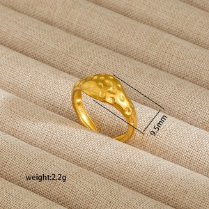 Macro shot of gold hammered stainless steel ring with 9.5mm width and 2.2g weight detail