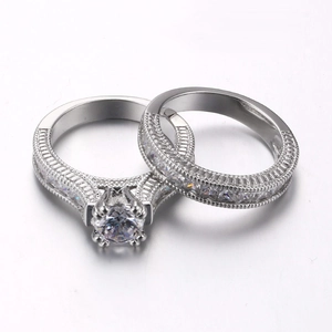 Elegant silver wedding ring set with round cut cubic zirconia and micro pave detailing