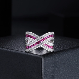 Crisscross mask ring with rose red zircon and white stones in silver-plated finish