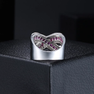 Luxurious silver wide band heart hollow ring with ruby red zircons on black background