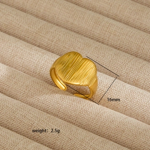Detail showing vertical stripe texture on 18K gold plated heart ring with 16mm diameter