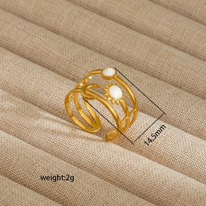 Detailed view of irregular 18K gold plated ring with moon and sun motifs, 14.5mm diameter