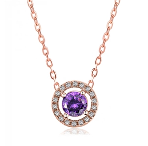 Macro detail of round purple zircon pendant with rose gold plating and crystal halo