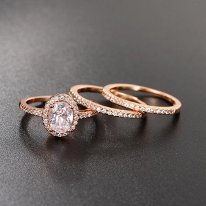 Three-piece rose gold oval zircon engagement ring set with micro-paved bands