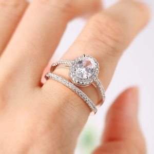 Oval cut zircon wedding ring set in silver with double-layered stacked band design