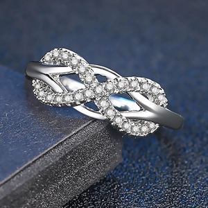 Sparkling infinity bow ring in silver finish with micro-paved cubic zirconia stones