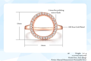 Detail view of hollow O-shaped rose gold ring with zircon stones and size measurements