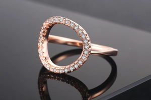 Detailed close-up of rose gold O-ring featuring brilliant micro-pave cubic zirconia
