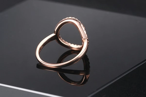 Detailed macro view of S925 sterling silver stamp on rose gold zircon ring band