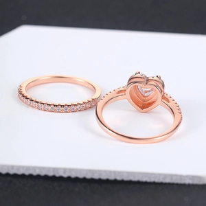Rose gold heart ring set with cubic zirconia stones shown in a 45-degree angle view