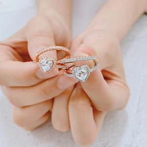 Classic rose gold and silver heart-shaped engagement rings with pave-set zircon stones