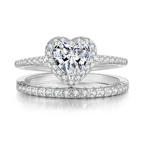 Macro shot of silver heart-shaped ring set with micro-paved cubic zirconia stones