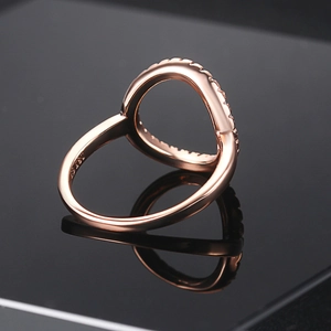 Minimalist S925 rose gold O-shaped ring with zircon inlay on a sleek black background